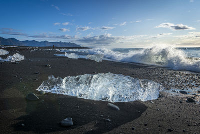 Ice formations on beach during sunrise, vestmannaeyjar, iceland, southern region