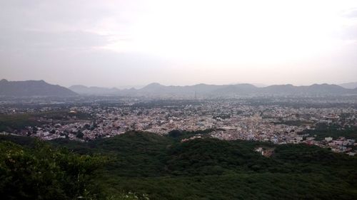 High angle view of buildings in city against sky