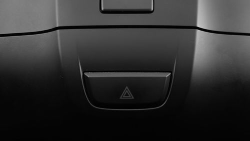 Close-up of push button on car door