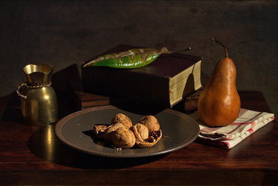 Close-up of fruits in plate on table