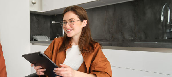 Young woman using mobile phone