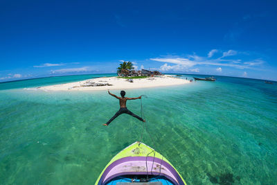 Scenic view of sea against blue sky