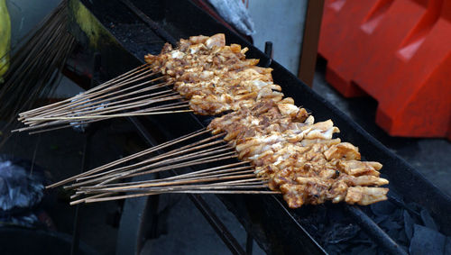 High angle view of meat on barbecue grill