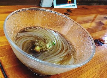 High angle view of drink in glass on table