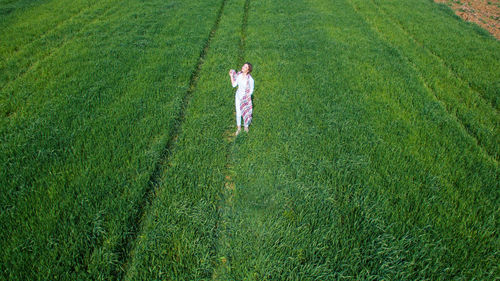 Full length of a man walking on field