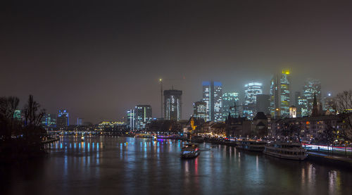 Illuminated city at waterfront