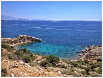 Scenic view of sea against blue sky