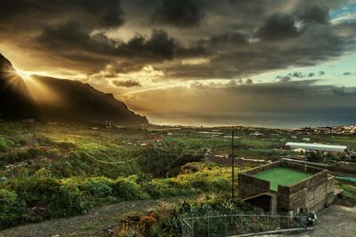 Scenic view of landscape against cloudy sky