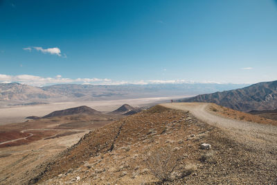 View of desert against cloudy sky