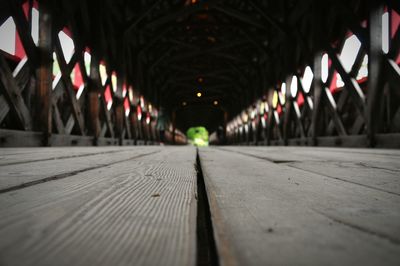 Close-up of illuminated footbridge at night