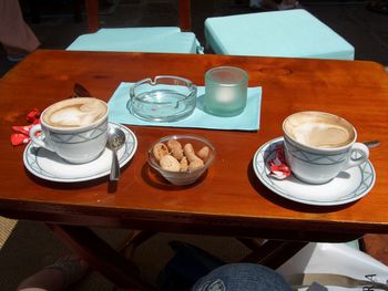 High angle view of coffee served on table