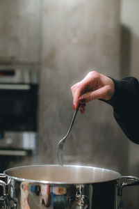 Cropped hand of man preparing food