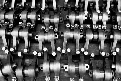 Full frame shot of machine parts arranged on table