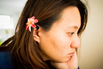 Close-up of girl with flowers