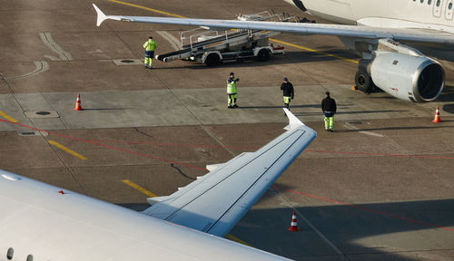 High angle view of people on airport runway