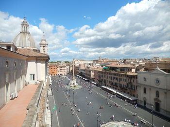 High angle view of road by buildings against sky