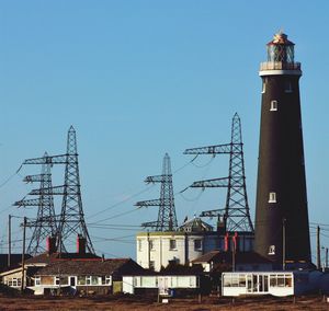 Low angle view of buildings against clear blue sky