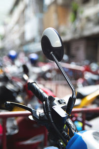 Close-up of motorcycle on street