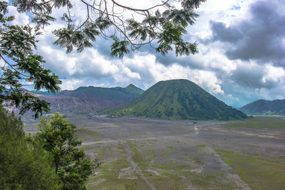 Scenic view of landscape and mountains against sky