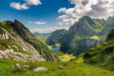 View from above of the seealpsee, surrounded by the swiss alps. canton of appenzell, switzerland.