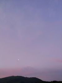 Scenic view of mountains against sky at night