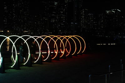 Illuminated lights in city at night