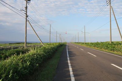 Empty road against sky