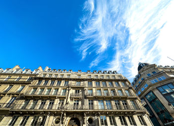 Low angle view of building against clear blue sky