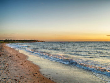 Scenic view of sea at sunset