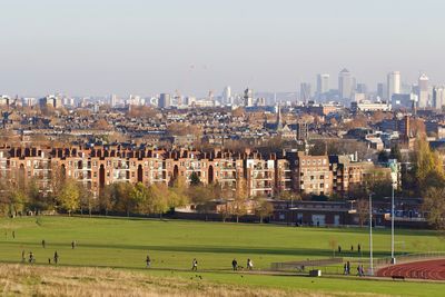 Buildings in city against sky