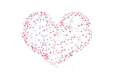 Close-up of heart shape decoration against white background