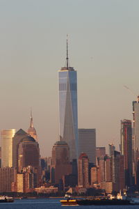 View of skyscrapers against sky during sunset