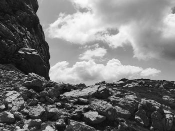 Low angle view of rock formation against sky