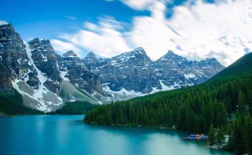 Scenic view of lake with mountain range in background