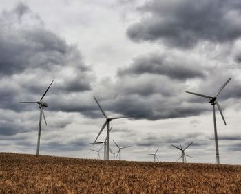 Wind turbines in field