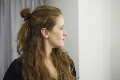 Portrait of young woman looking away