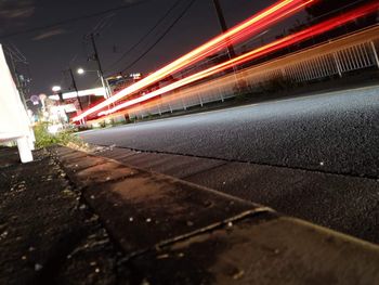 Light trails on road in city at night