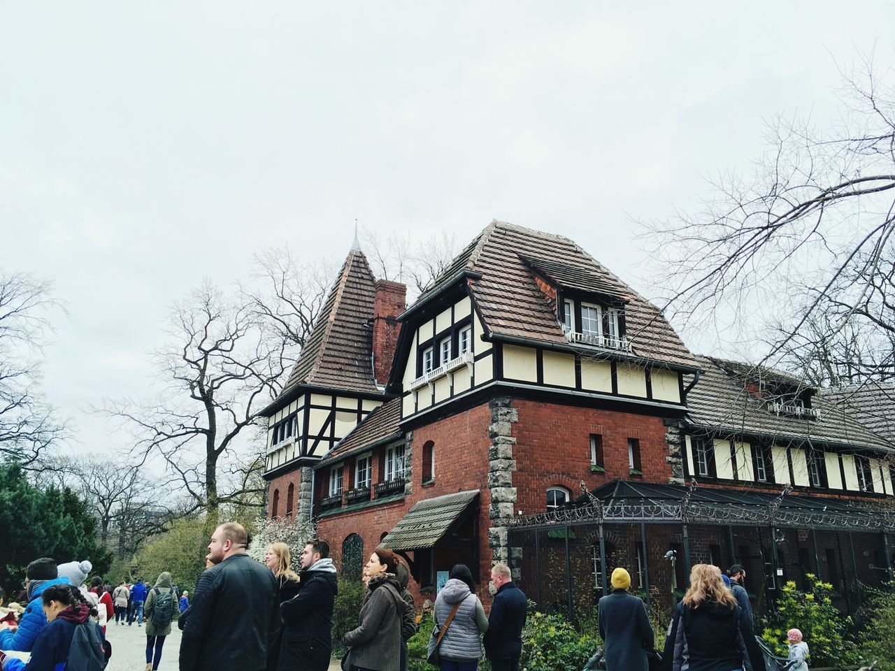 GROUP OF PEOPLE IN FRONT OF BUILDING