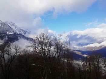 Scenic view of snow covered mountains against sky