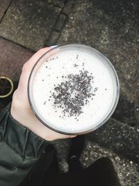 Cropped image of hand holding drink