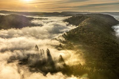 Aerial view of landscape against sky during sunset