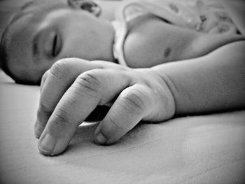 Close-up of hands holding baby