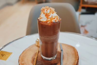Close-up of coffee served on table