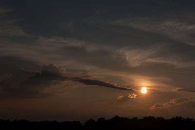 Scenic view of silhouette trees against sky at sunset