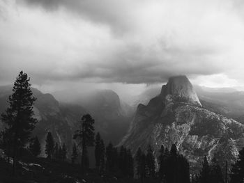 Scenic view of mountains against cloudy sky