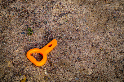 High angle view of yellow toy on field