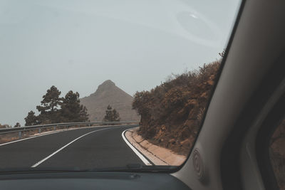 Road seen through car windshield