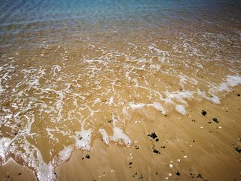 High angle view of waves on shore 