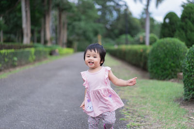 Portrait of cute girl standing outdoors