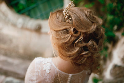 Close-up portrait of woman wearing crown